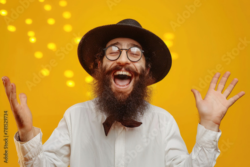 Portrait of a happy young jewish men with festival celebration pesach passover isolated on yellow studio background.