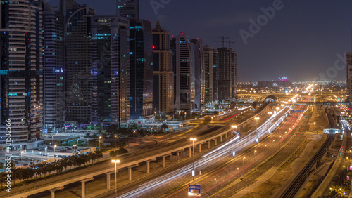 Aerial top view to Sheikh Zayed road near Dubai Marina and JLT night to day timelapse, Dubai. photo