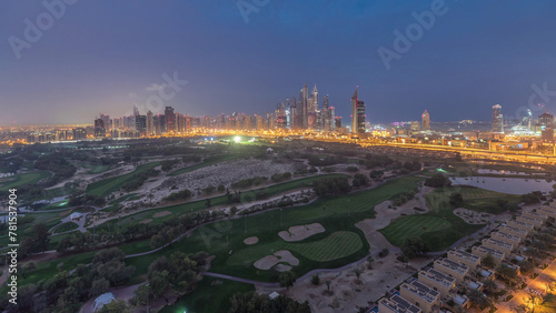 Dubai Marina skyscrapers and golf course night to day timelapse, Dubai, United Arab Emirates