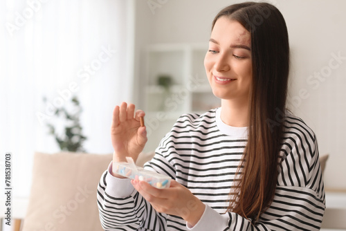 Young woman holding contain...