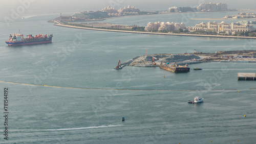 Aerial view of Palm Jumeirah man made island from JBR district before sunset timelapse. Dubai, UAE. photo