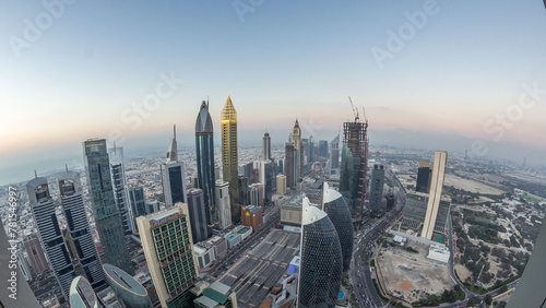 Skyline of the buildings of Sheikh Zayed Road and DIFC aerial day to night timelapse in Dubai  UAE.