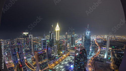 Skyline of the buildings of Sheikh Zayed Road and DIFC aerial night timelapse in Dubai  UAE.