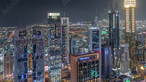 Fototapeta Naklejka Na Ścianę i Meble -  Skyline of the buildings of Sheikh Zayed Road and DIFC aerial night timelapse in Dubai, UAE.