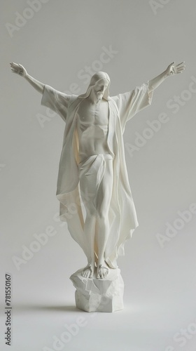 Christ the Redeemer in clay, arms spread wide, dawns first light on white