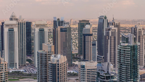 Dubai Marina skyscrapers and jumeirah lake towers view from the top aerial timelapse in the United Arab Emirates. © neiezhmakov