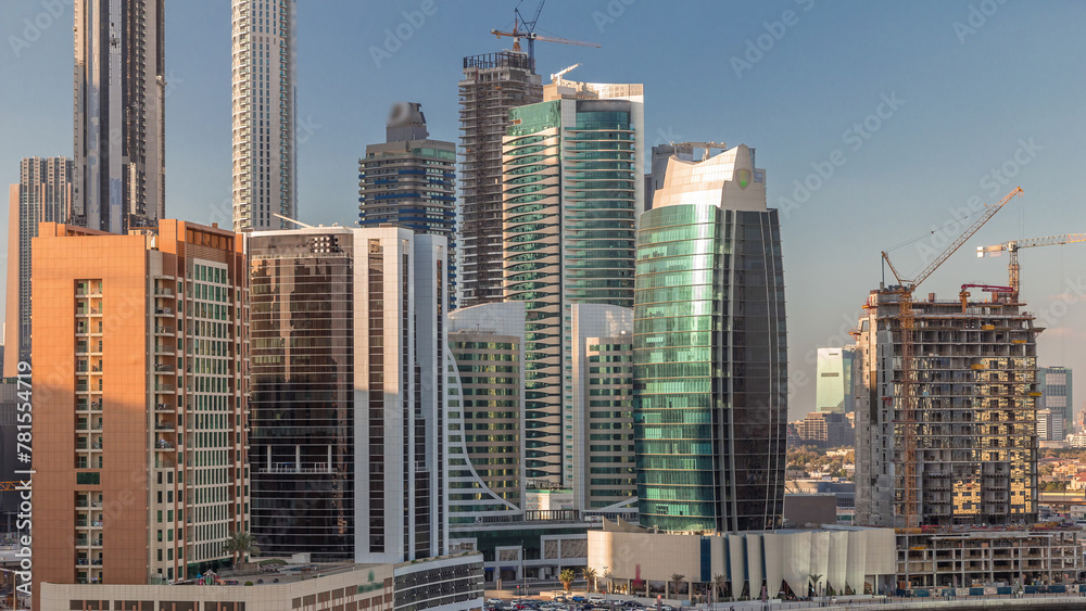 Skyscrapers at sunny day in Dubai with blue sky aerial timelapse