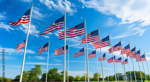 A field of American flags on a blue sky background. Holiday concept for 4th of July, President's Day, Independence Day, US National Day, Labor Day, Fourth of July