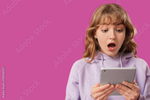 Young surprised woman with ...