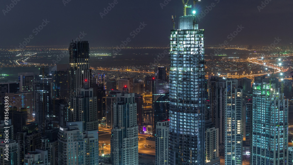 Naklejka premium Amazing aerial view of Dubai downtown skyscrapers night to day timelapse, Dubai, United Arab Emirates