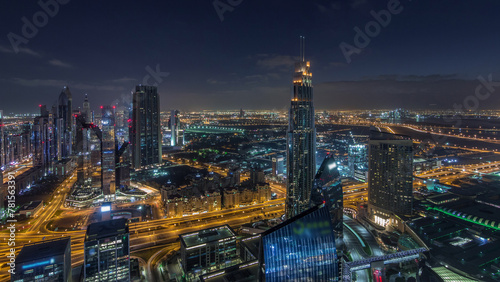 Dubai International Financial Centre district with modern skyscrapers night to day timelapse