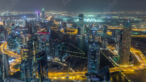 Panoramic aerial view of business bay towers in Dubai night timelapse. © neiezhmakov