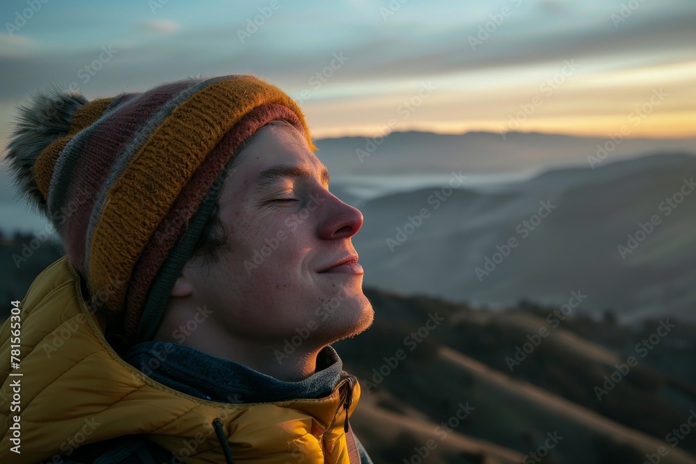 A serene view captures a person in a warm yellow jacket silently observing the gradient sunrise over rolling hills A serene view captures a person in a warm yellow jacket silently observing the gradient sunrise over rolling hills