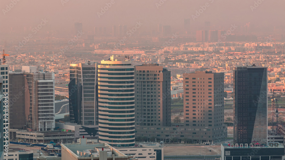 Fototapeta premium Dubai's business bay towers at morning aerial timelapse.