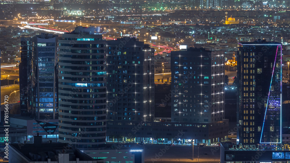 View of bright lights on tall skyscrapers near highways in Dubai city, United Arab Emirates Timelapse Aerial View of bright lights on tall skyscrapers near highways in Dubai city, United Arab Emirates Timelapse Aerial