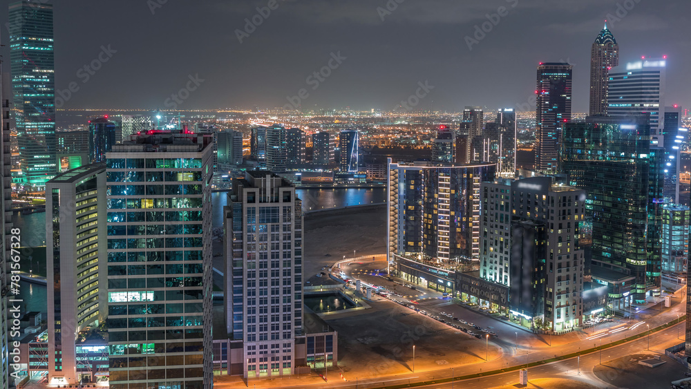 Fototapeta premium Dubai's business bay towers aerial night timelapse.
