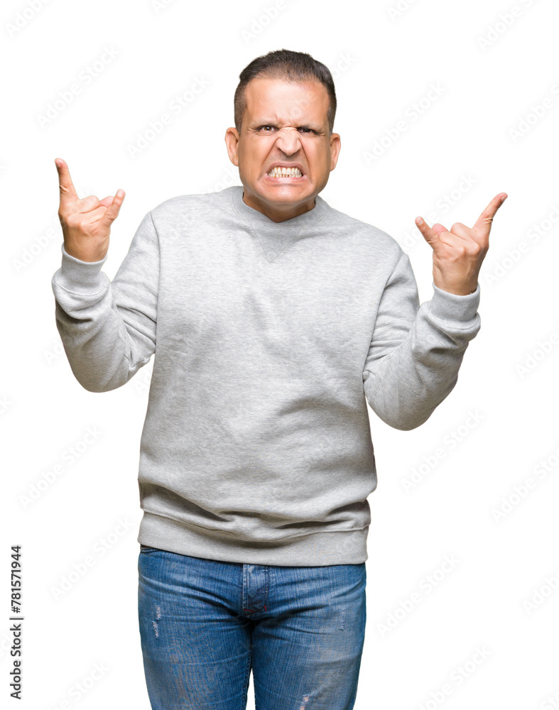 Middle age arab man wearing sport sweatshirt over isolated background shouting with crazy expression doing rock symbol with hands up. Music star. Heavy concept. Middle age arab man wearing sport sweatshirt over isolated background shouting with crazy expression doing rock symbol with hands up. Music star. Heavy concept.