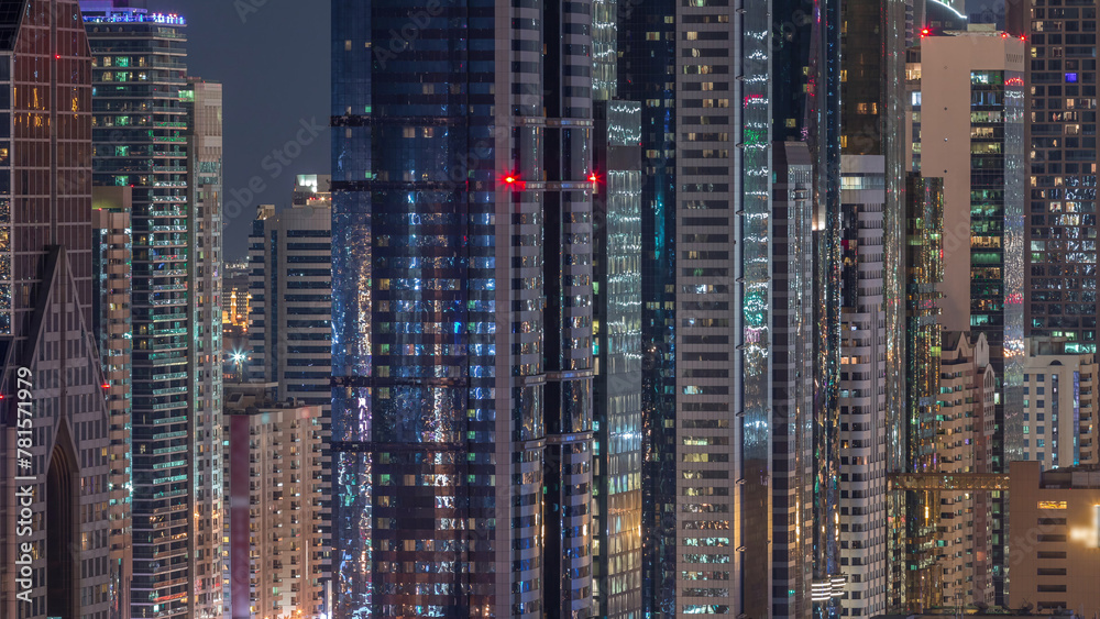 Obraz premium Dubai International Financial Centre district with modern skyscrapers night timelapse
