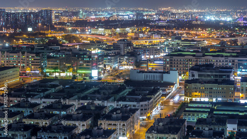 Aerial view of neighborhood Deira with typical buildings night timelapse, Dubai, United Arab Emirates