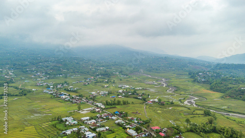 Rice field aerial shot at north east of India. Aerial views of beautiful mountain small house and rice terraces field at kangpokpi village rice terraces with senapati river manipur india. photo