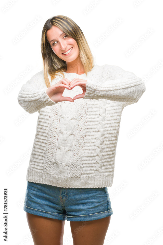 Young beautiful woman wearing winter sweater over isolated background smiling in love showing heart symbol and shape with hands. Romantic concept. Young beautiful woman wearing winter sweater over isolated background smiling in love showing heart symbol and shape with hands. Romantic concept.
