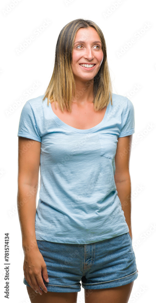 Fototapeta premium Young beautiful woman over isolated background looking away to side with smile on face, natural expression. Laughing confident.