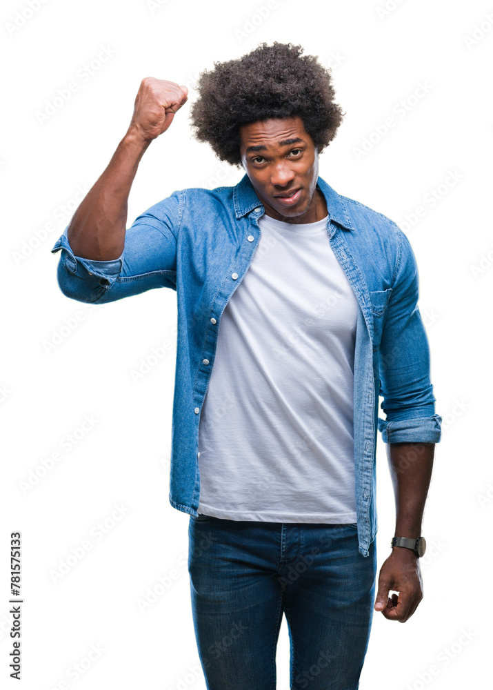 Afro american man over isolated background angry and mad raising fist frustrated and furious while shouting with anger. Rage and aggressive concept. Afro american man over isolated background angry and mad raising fist frustrated and furious while shouting with anger. Rage and aggressive concept.