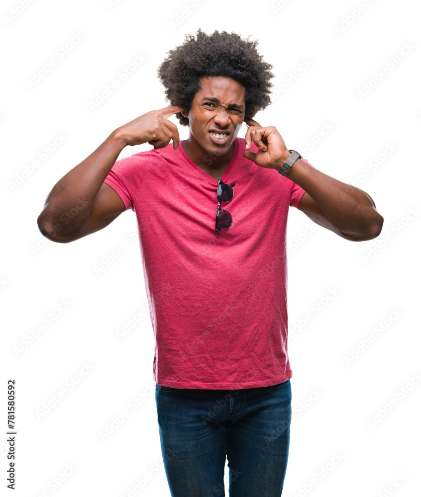 Afro american man over isolated background covering ears with fingers with annoyed expression for the noise of loud music. Deaf concept. Afro american man over isolated background covering ears with fingers with annoyed expression for the noise of loud music. Deaf concept.