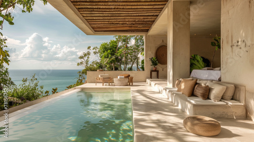 Calm outdoor scene of aman style raw material finish hotel villa in an the mexican tropics with a plunge pool and ocean views