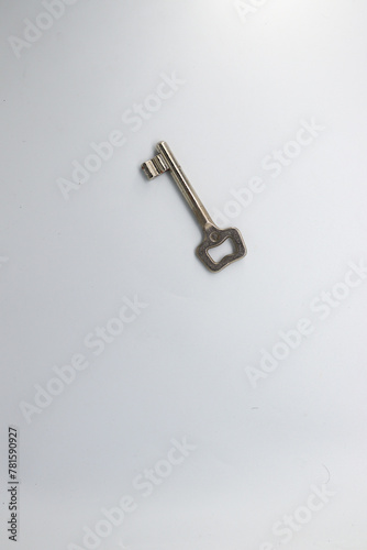 Close up of a key, white background. © SKNET