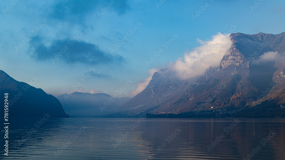 Alpine landscape. Spring Italy. A beautiful Italian lake in the Alps. Atmospheric landscape. Recreation in nature. Incredibly beautiful in the mountains.