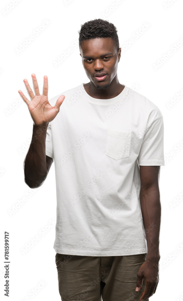 Young african american man wearing white t-shirt showing and pointing up with fingers number five while smiling confident and happy. Young african american man wearing white t-shirt showing and pointing up with fingers number five while smiling confident and happy.