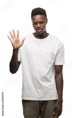 Young african american man wearing white t-shirt showing and pointing up with fingers number five while smiling confident and happy. © Krakenimages.com