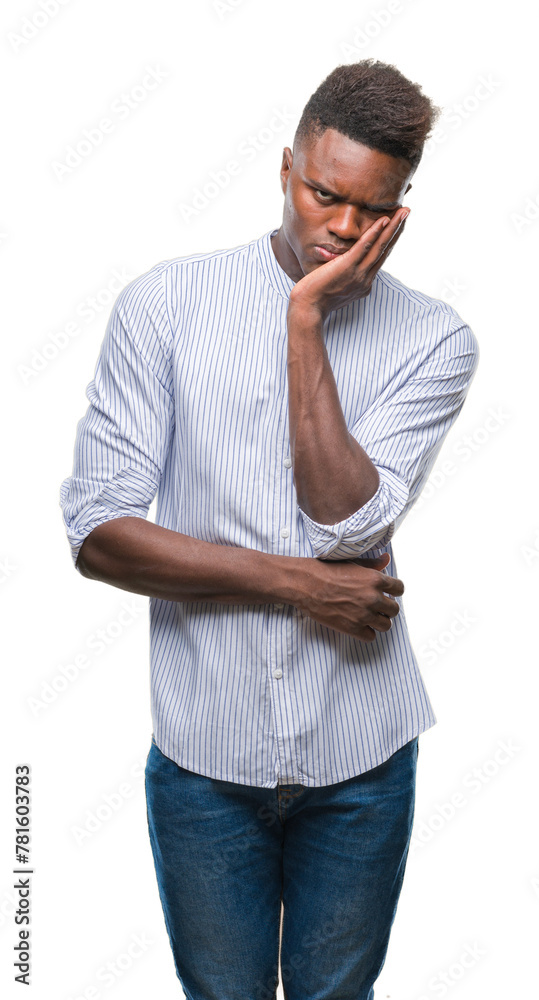 Young african american man over isolated background thinking looking tired and bored with depression problems with crossed arms. Young african american man over isolated background thinking looking tired and bored with depression problems with crossed arms.