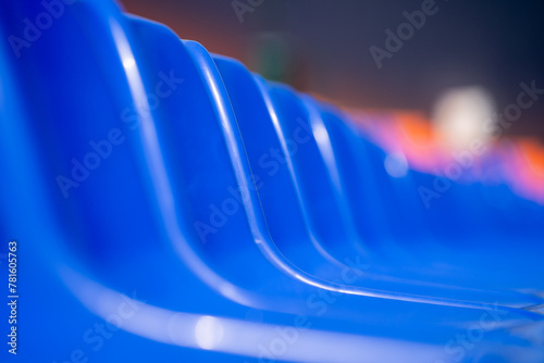 Empty blue seats in the stadium.