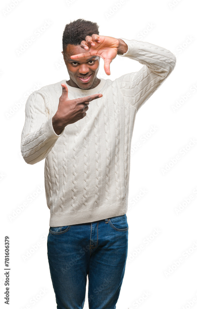 Fototapeta premium Young african american man over isolated background smiling making frame with hands and fingers with happy face. Creativity and photography concept.