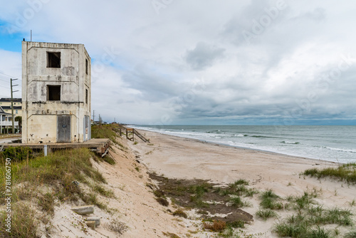Abandoned old building on the beach dunes