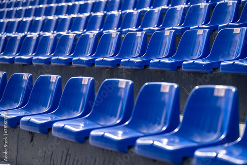 Empty blue seats with numbers in the stadium.