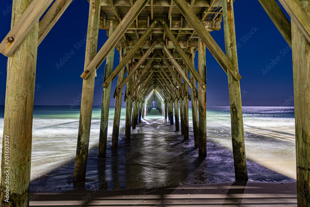 under the pier at night