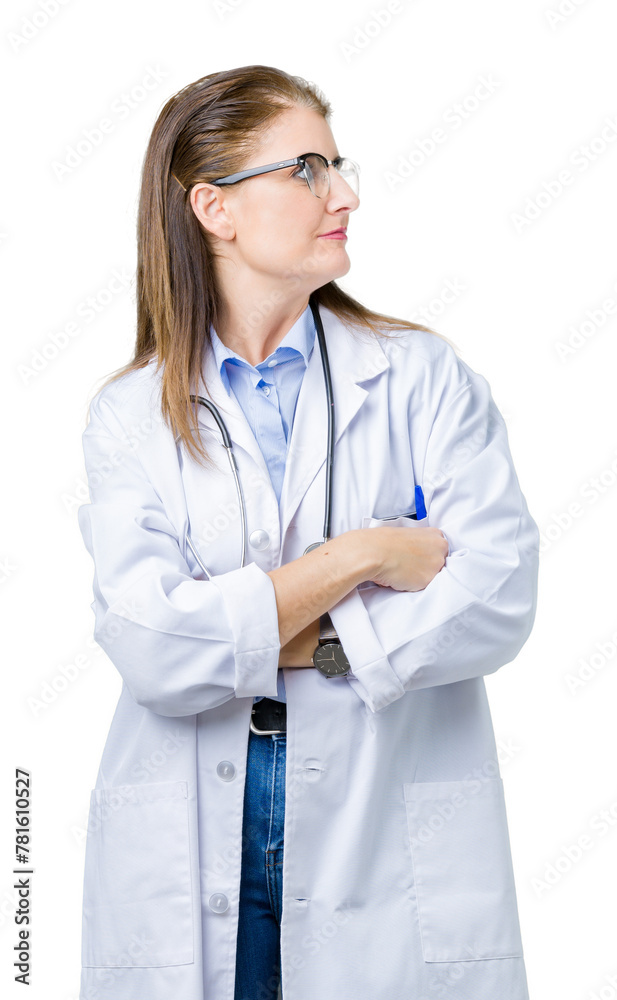 Middle age mature doctor woman wearing medical coat over isolated background smiling looking to the side with arms crossed convinced and confident Middle age mature doctor woman wearing medical coat over isolated background smiling looking to the side with arms crossed convinced and confident