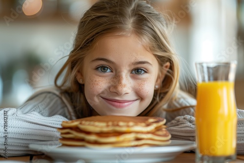 Caucasian girl leaning on a table in front of pancakes, with a playful smile.