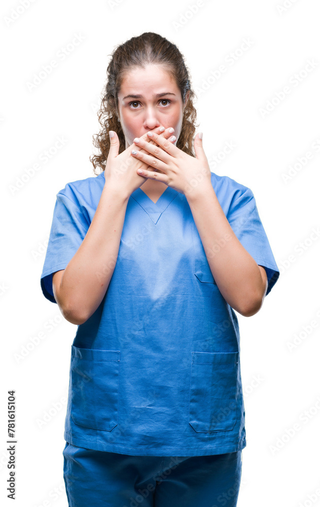 Young brunette doctor girl wearing nurse or surgeon uniform over isolated background shocked covering mouth with hands for mistake. Secret concept. Young brunette doctor girl wearing nurse or surgeon uniform over isolated background shocked covering mouth with hands for mistake. Secret concept.