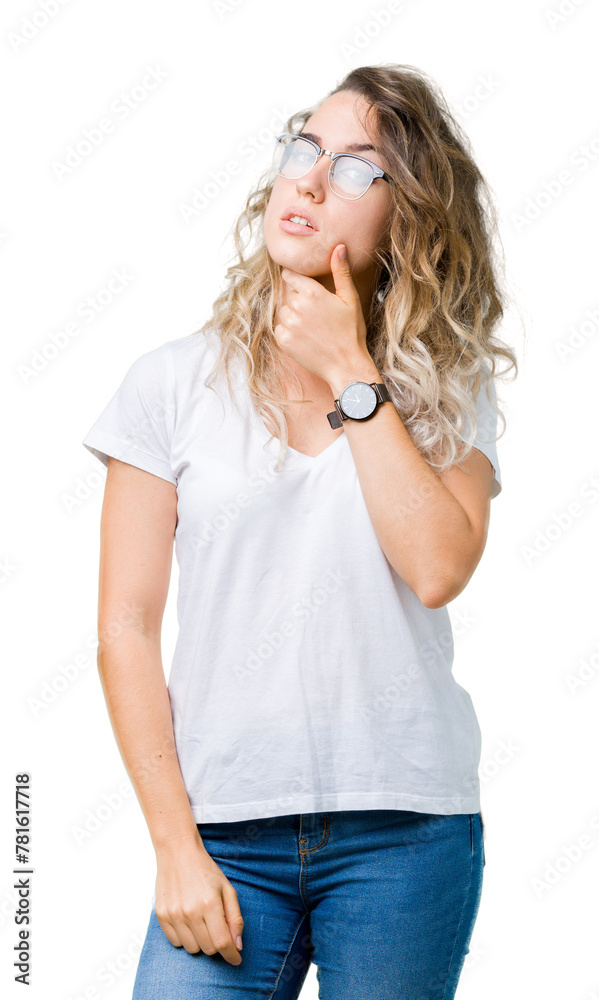 Beautiful young blonde woman wearing glasses over isolated background looking confident at the camera with smile with crossed arms and hand raised on chin. Thinking positive. Beautiful young blonde woman wearing glasses over isolated background looking confident at the camera with smile with crossed arms and hand raised on chin. Thinking positive.