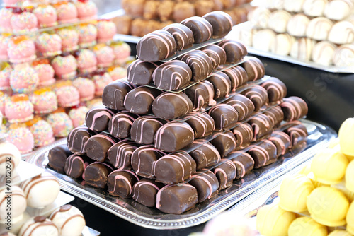 Sweetness balls build as a pyramid for sle in a pastry shop