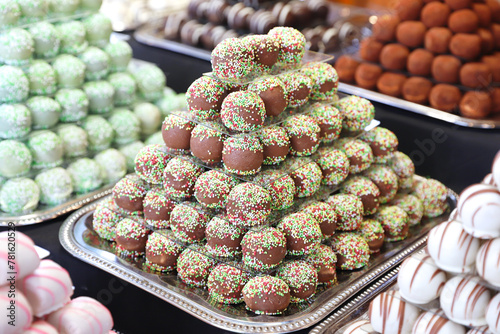 Sweetness balls build as a pyramid for sle in a pastry shop