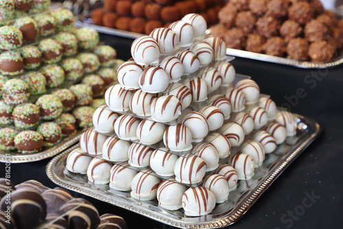 Sweetness balls build as a pyramid for sle in a pastry shop