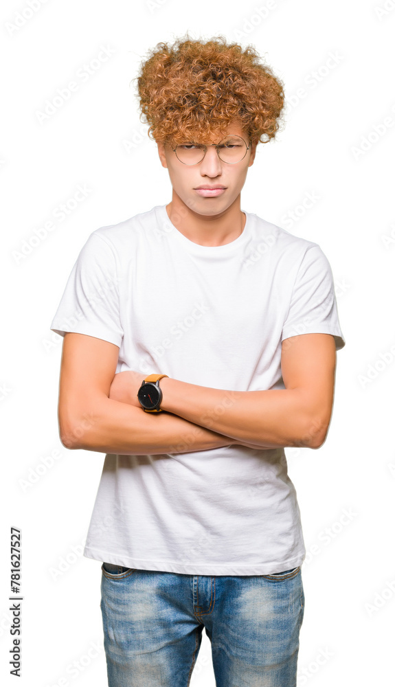 Young handsome man with afro hair wearing glasses skeptic and nervous, disapproving expression on face with crossed arms. Negative person. Young handsome man with afro hair wearing glasses skeptic and nervous, disapproving expression on face with crossed arms. Negative person.