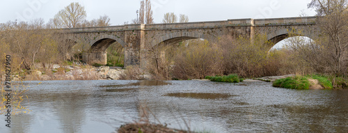 Medieval bridge with the Tormes river in Guijuelo, Salamanca, Spain