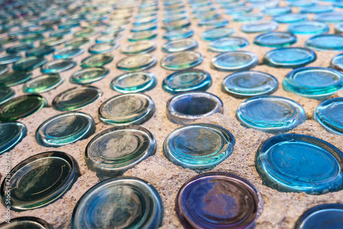path paved with circular glass pieces
