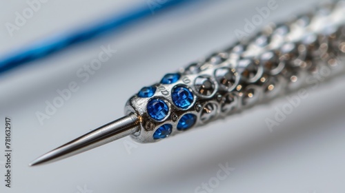 Sewing needle with blue thread in the eye close-up on white background
